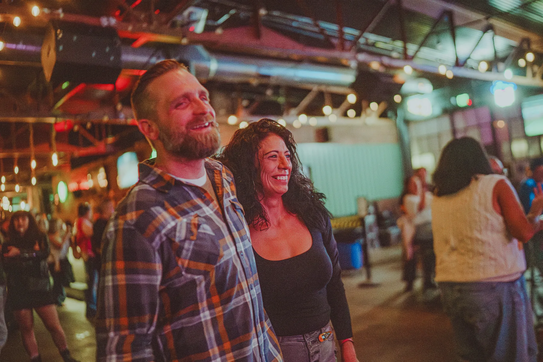 Guests smiling together during a club night at The Gaslight Social