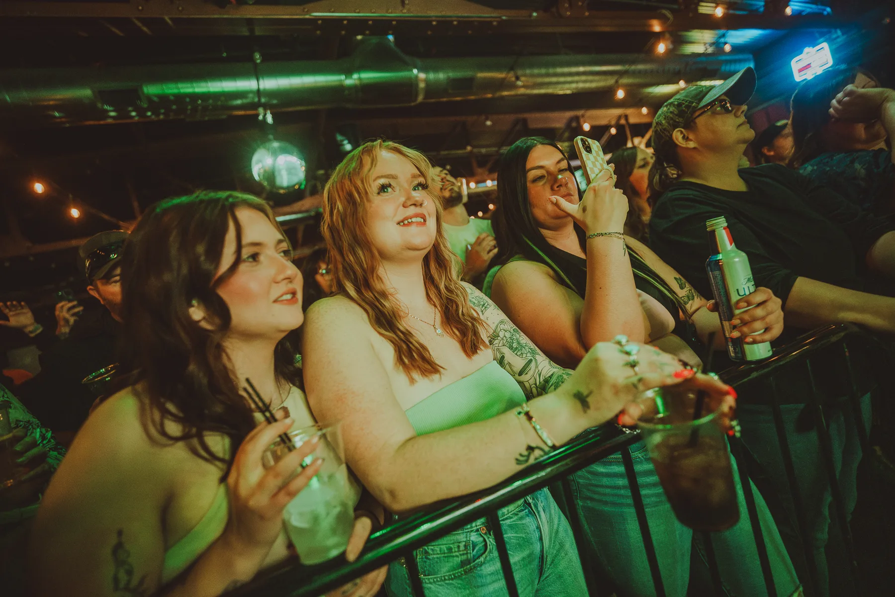 Friends at the rail during a show at The Gaslight Social